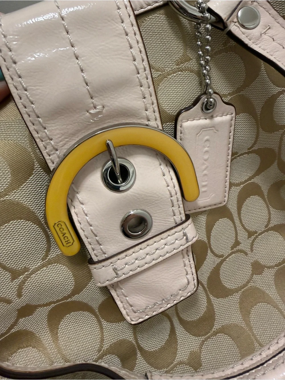 Coach VintageBeige Signature Shoulder Bag with Pale Pink Trim and Yellow Accent